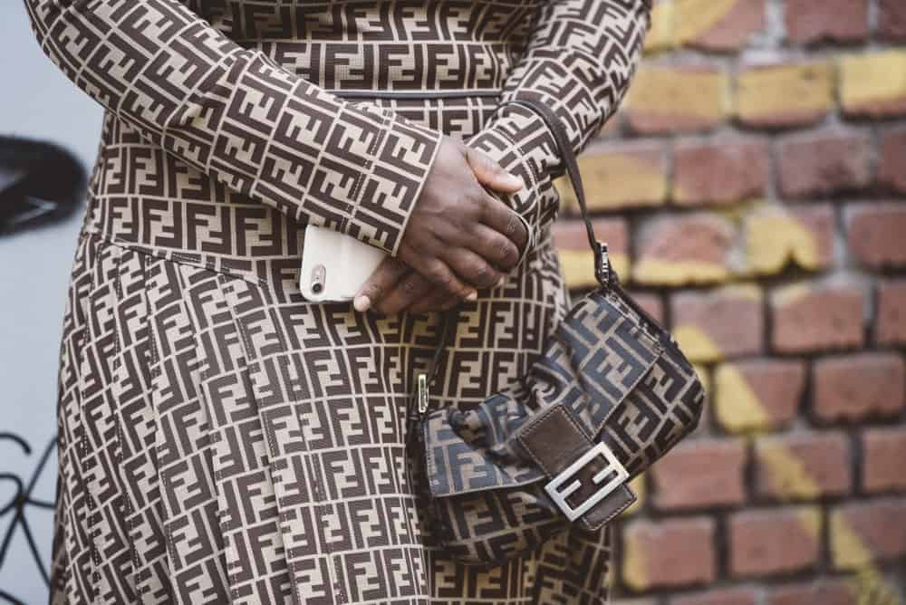 Woman in a Fendi outfit with matching bag.