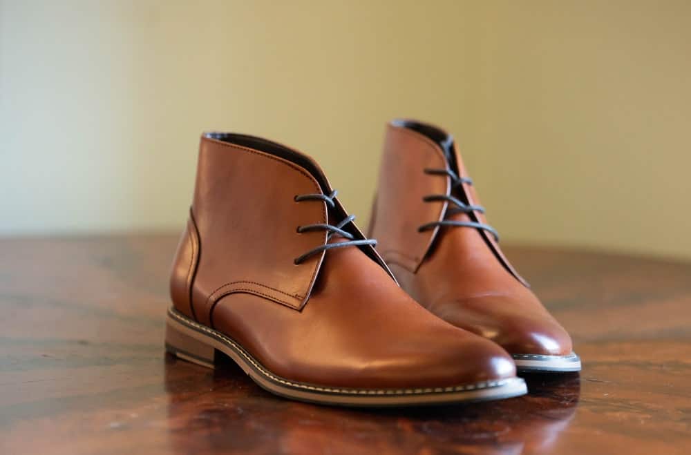  Italian chukka boots over the hardwood floor.
