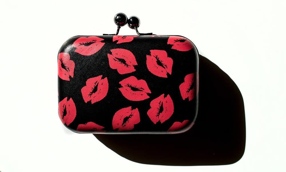 Black clutch with print of red lips or kisses.