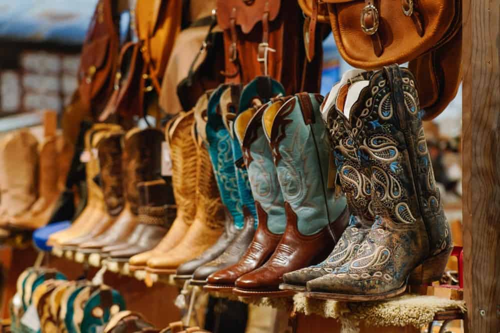 Cowboy boots displayed on a shelf.