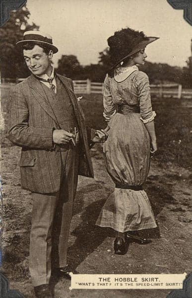 Man pointing his thumb on a woman wearing a hobble skirt.