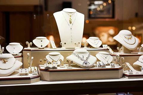 A variety of jewelry on display in a store.