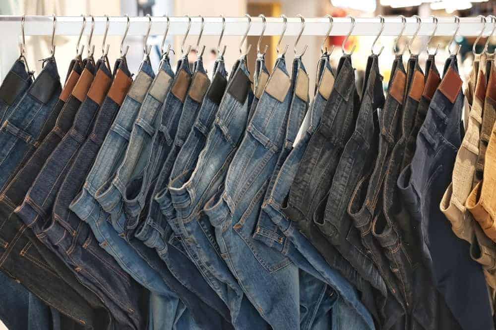 Sets of jeans on display at a store.