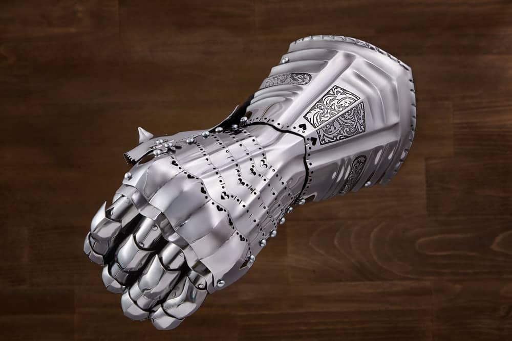 A close look at a steel armored glove.