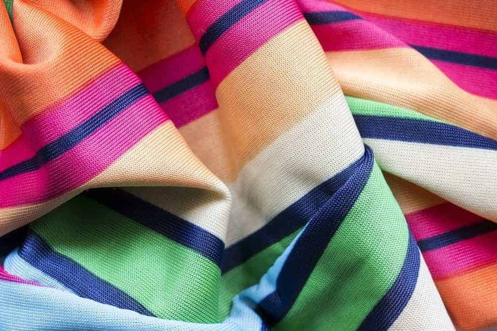 A close up of a colorful viscose scarf.