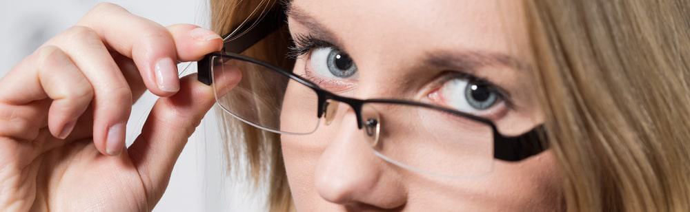 Close-up of a woman wearing designed spectacles.