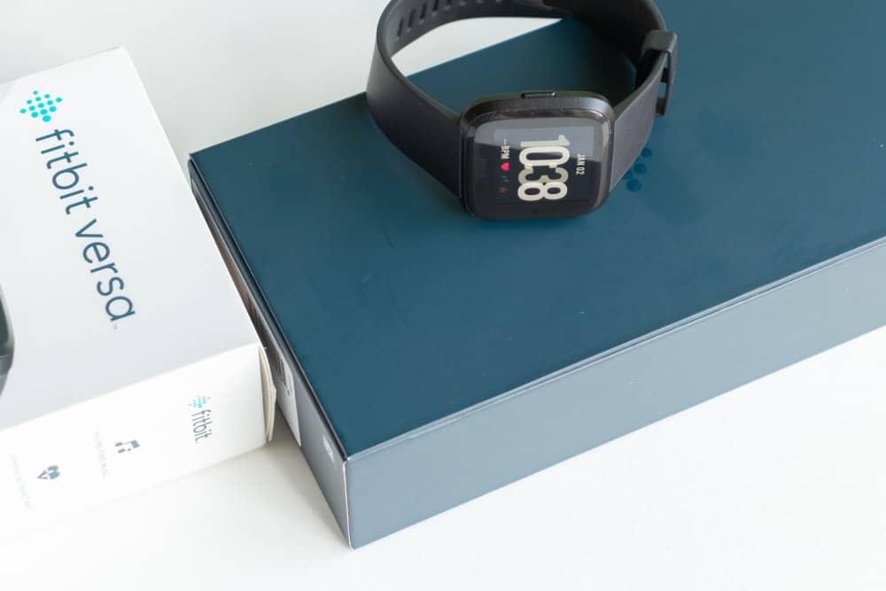 A brand new Fitbit Versa on its box.