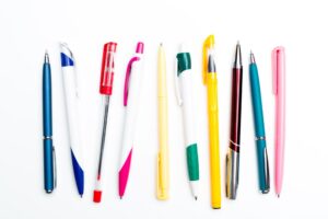 Various types of pens on a white background