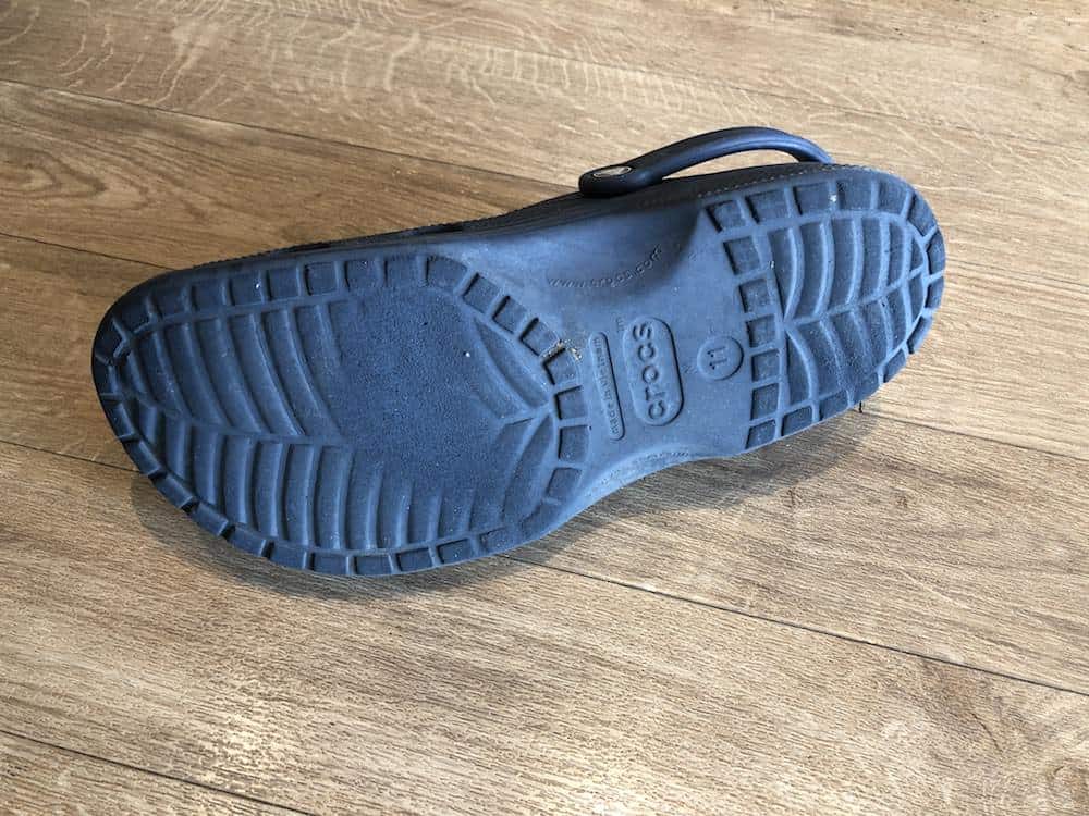 Bottom of Crocs depicting the bottom tread being worn out