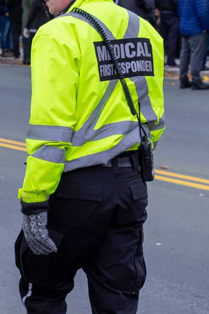 A close look at a male medical first responder wearing dark cargo pants.