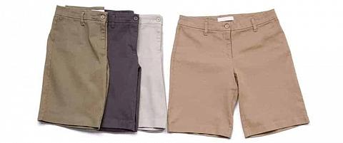 Four men's shorts on a white surface.