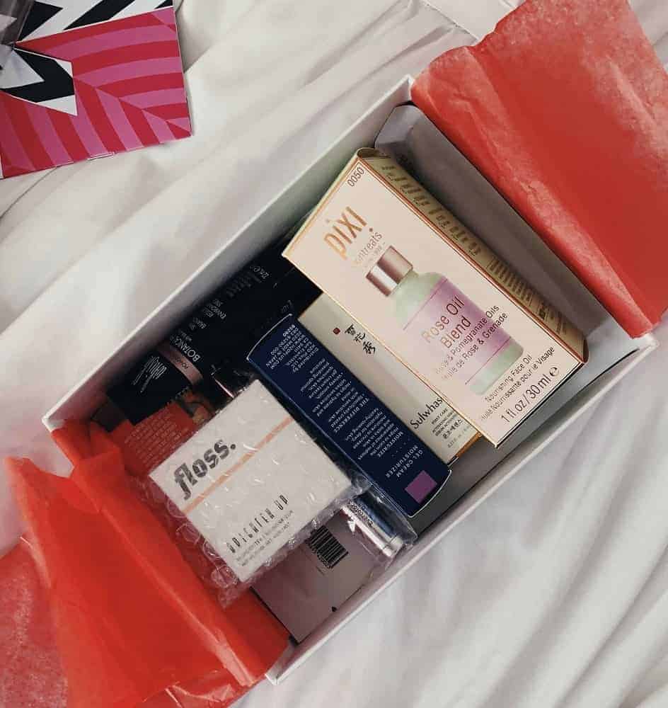Allure beauty box filled with various beauty products in sample sizes.