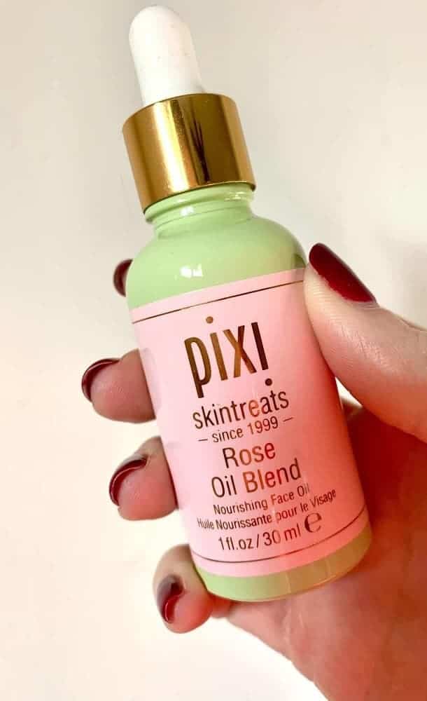 A close look at a bottle of Pixi rose oil blend from Allure beauty box.