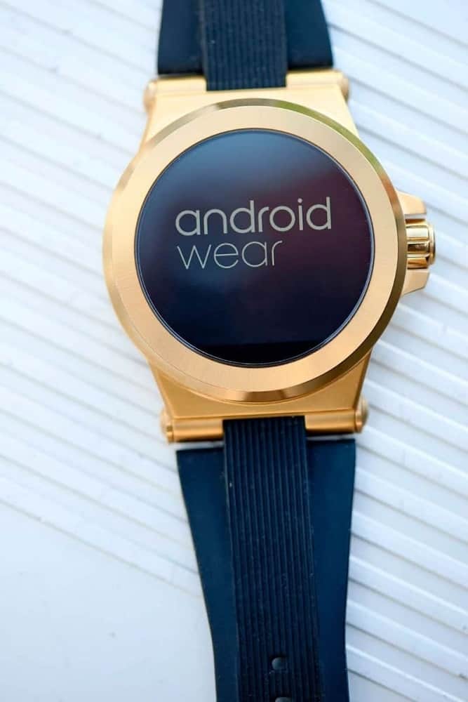 Gold Michael Kors Access smartwatch with all black band and watch face design.