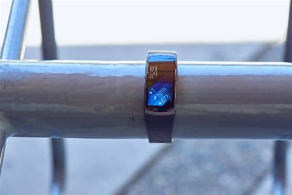 The Samsung Gear Fit 2 Smartwatch displayed on a tube.