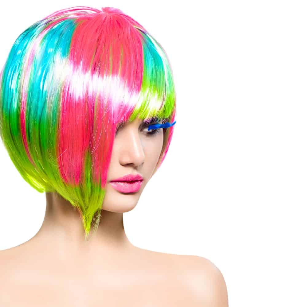 Model with colorful dyed hair in short bob and fringe.