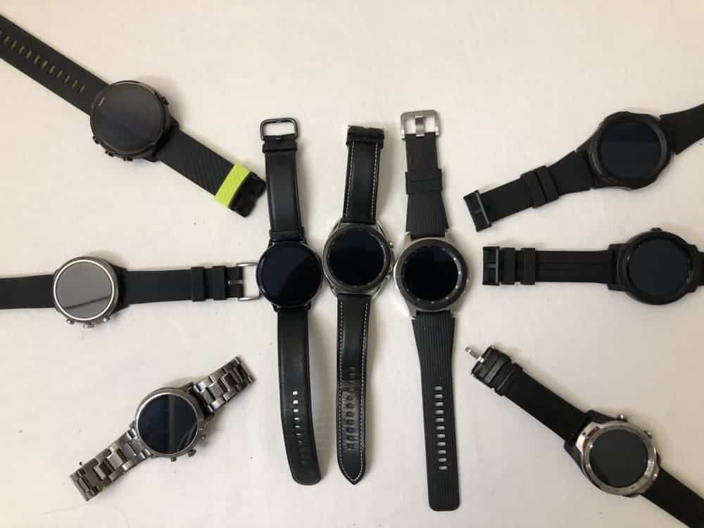 Wear OS watches surrounds three Samsung Tizen OS watches