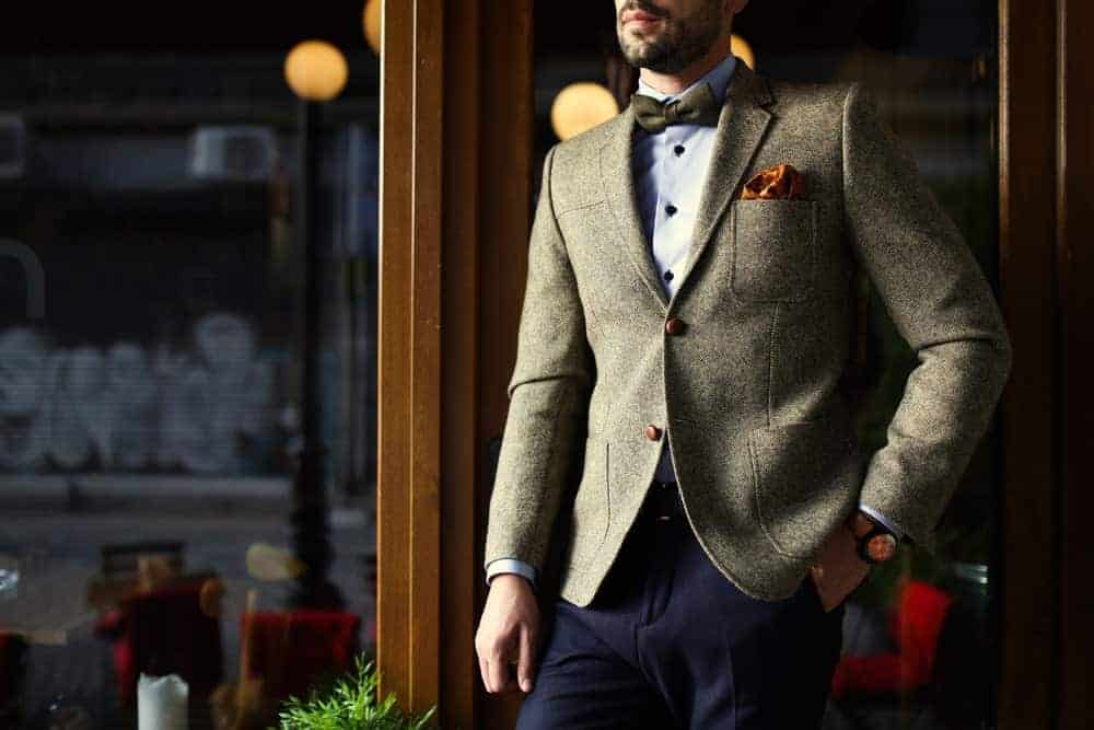 Man wearing a smart casual outfit with a bow tie.