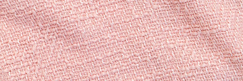 A close look at a pink even sided twill cloth.