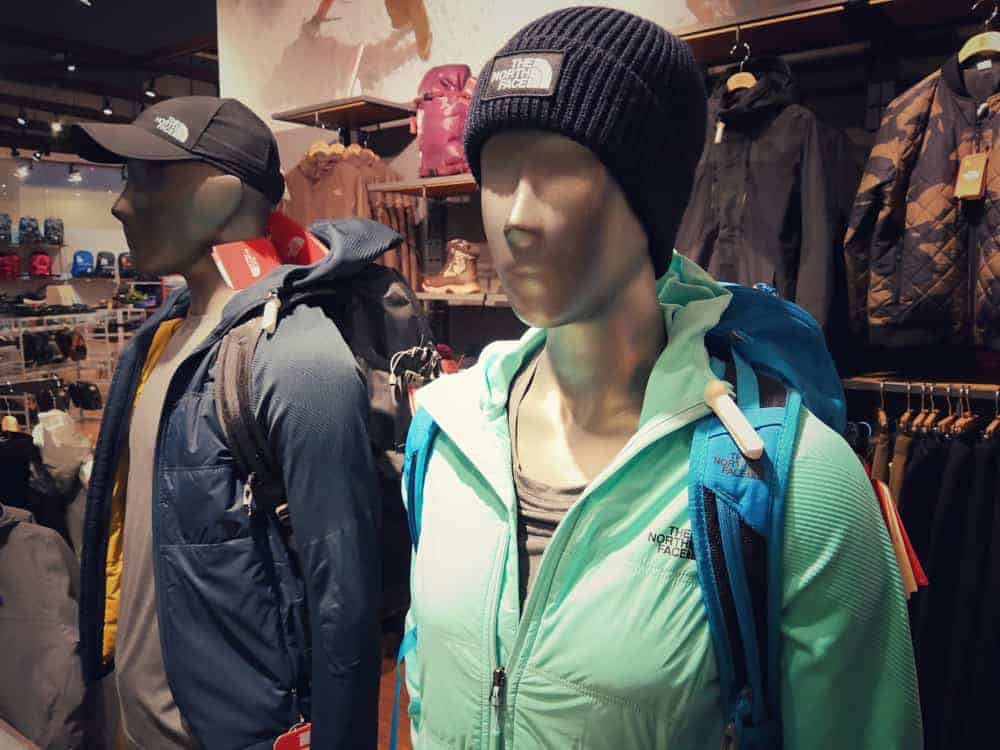 The North Face Outlet with jackets and backpacks on display.