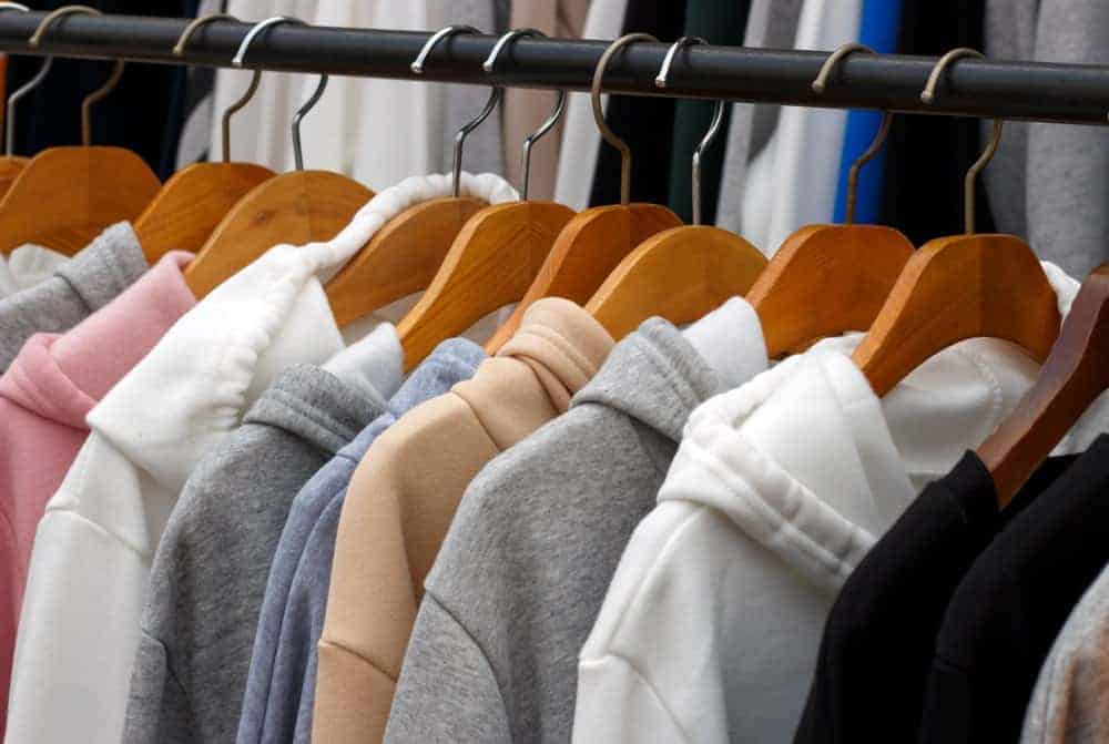 This is a close look at a rack of sweatshirts.