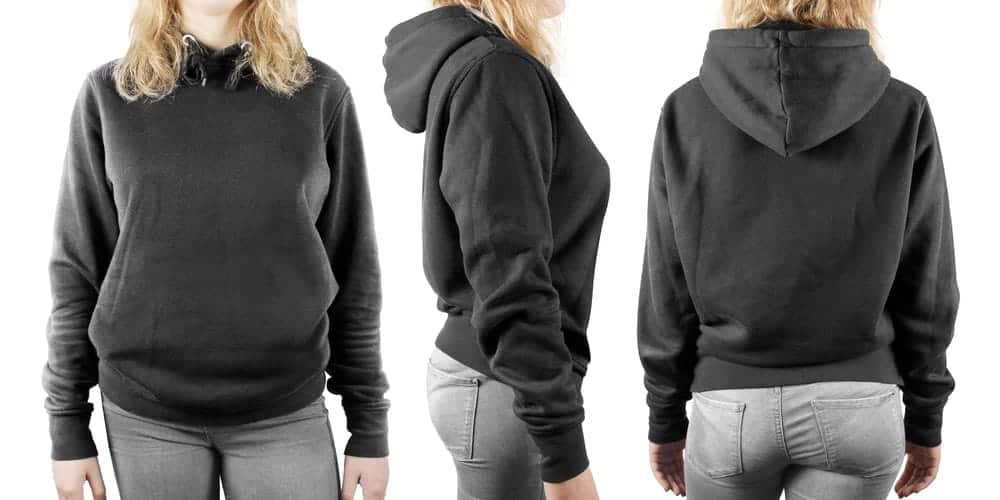 Front, back and side view of a black pullover sweatshirt worn by a woman.
