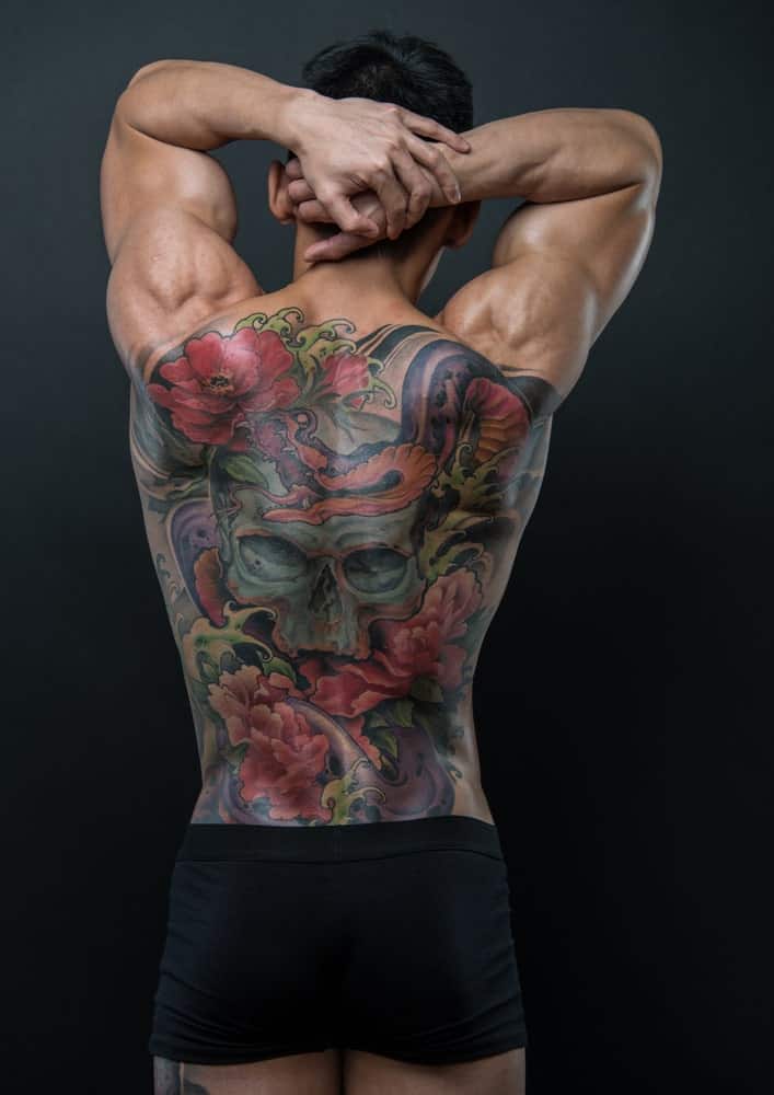 This is a close look at a man's back with Japanese tattoos.