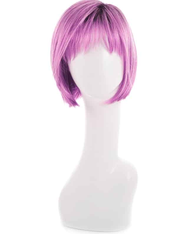 A close look at a purple wig on a white wig storage.