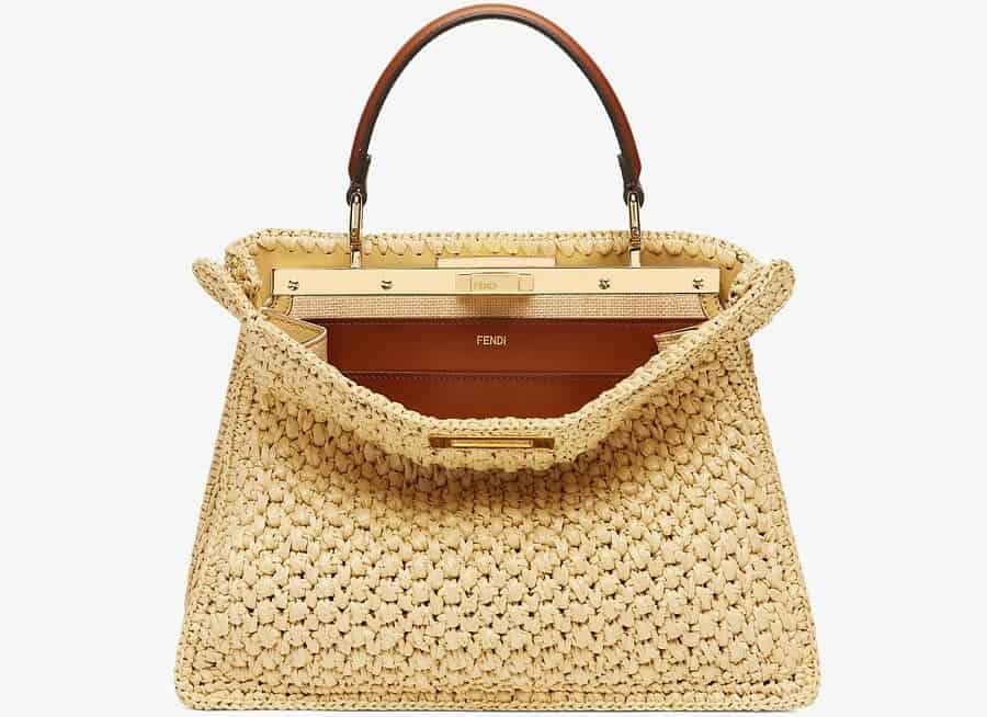 The Fendi Woven Straw handbag with leather interior and gold accents.