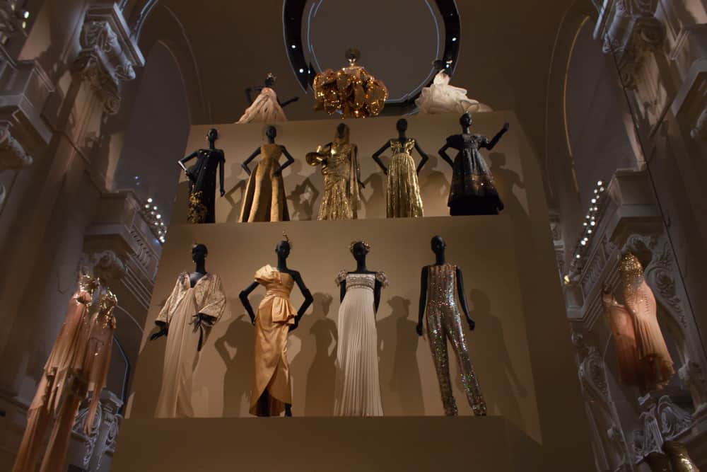 Dresses designed by Christian Dior presented in an exhibition.