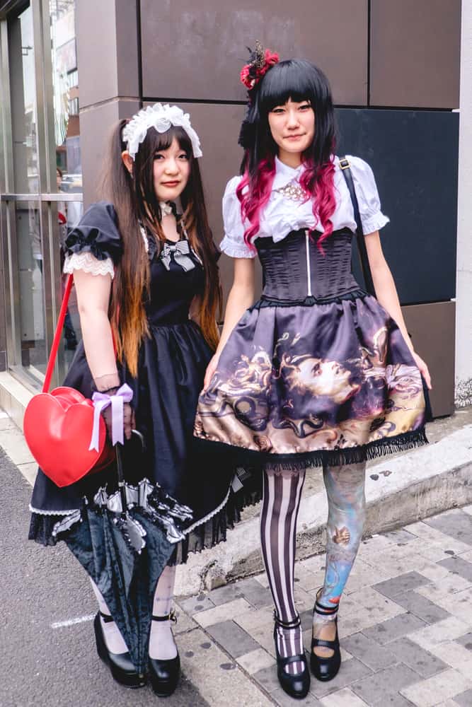 Japanese girls in gothic lolita style outfits.