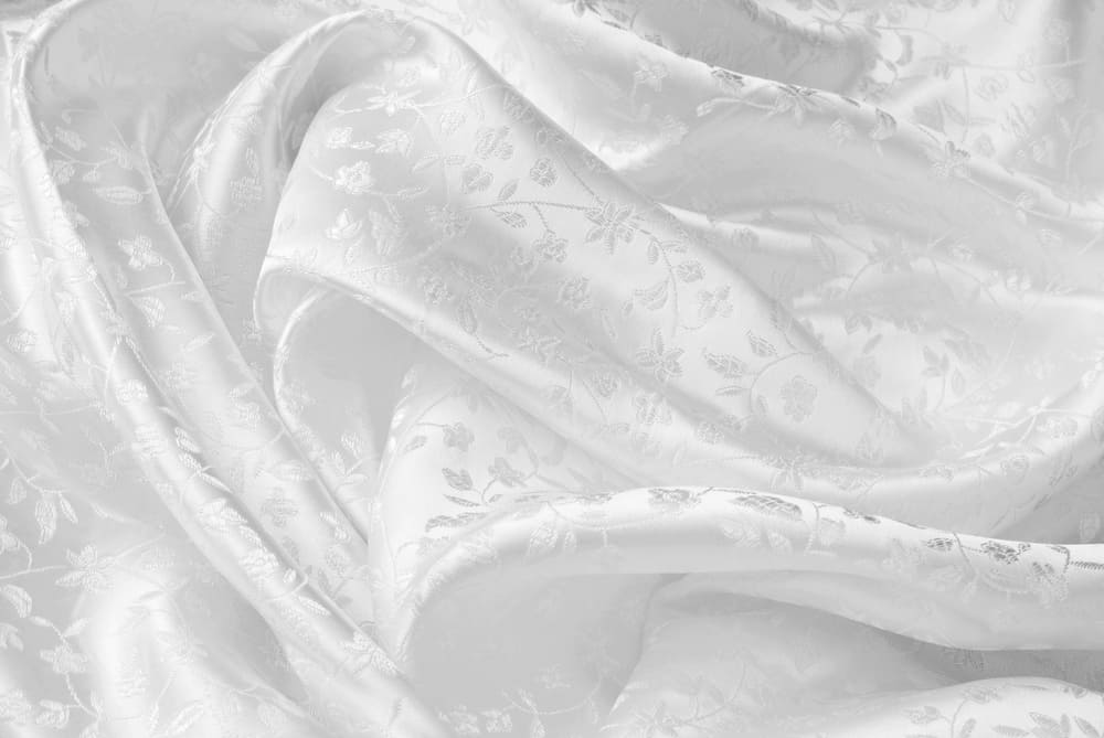 This is a close look at a wedding gown with a Satin Brocade patterned fabric.