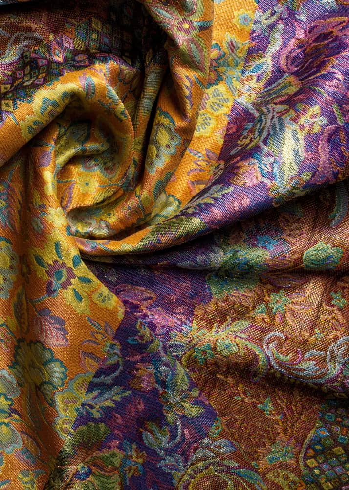 This is a close look at a colorful and patterned Damask Brocade fabric.