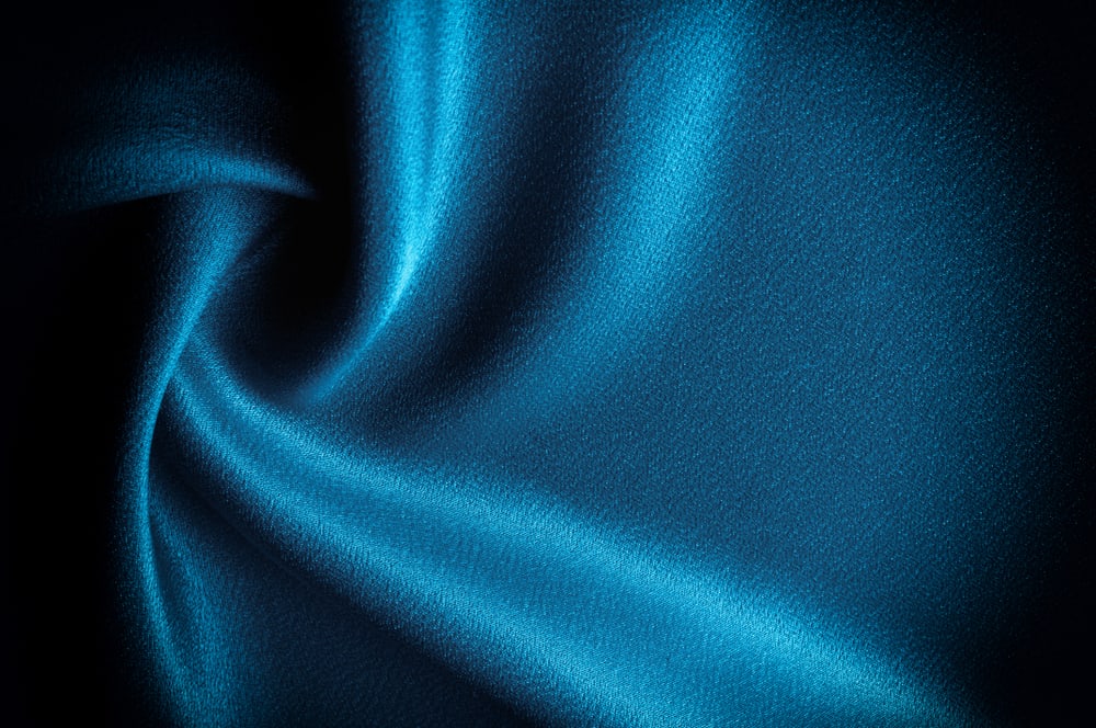This is a close look at a piece of blue Silk Fabric.
