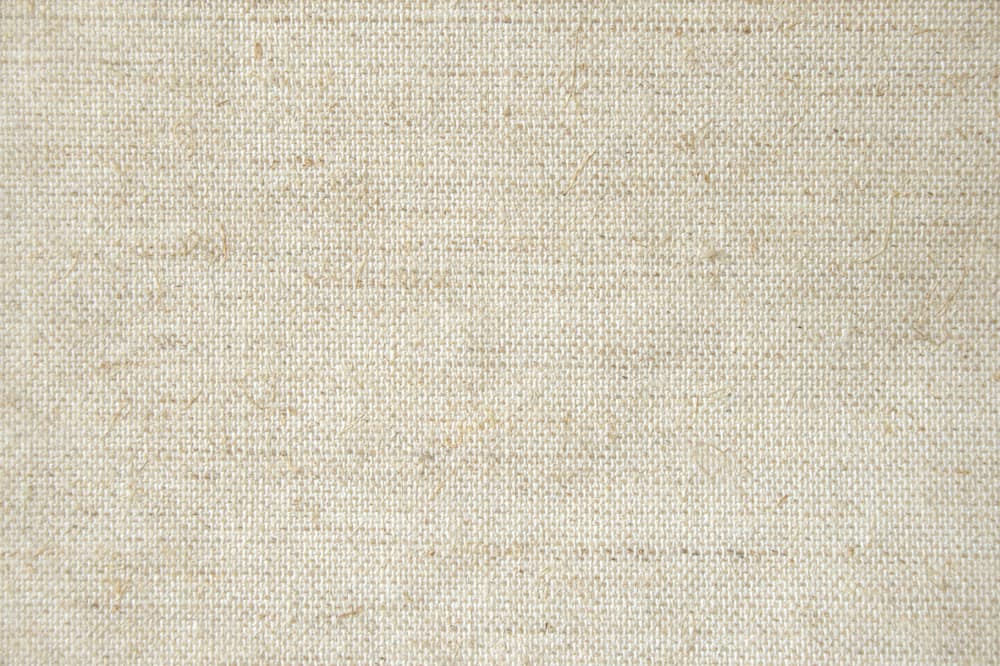 This is a close look at a beige muslin fabric.
