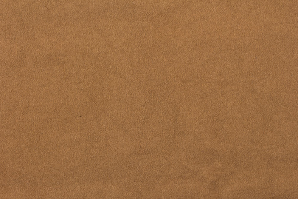 This is a close look at a suede fabric with a brown tone.