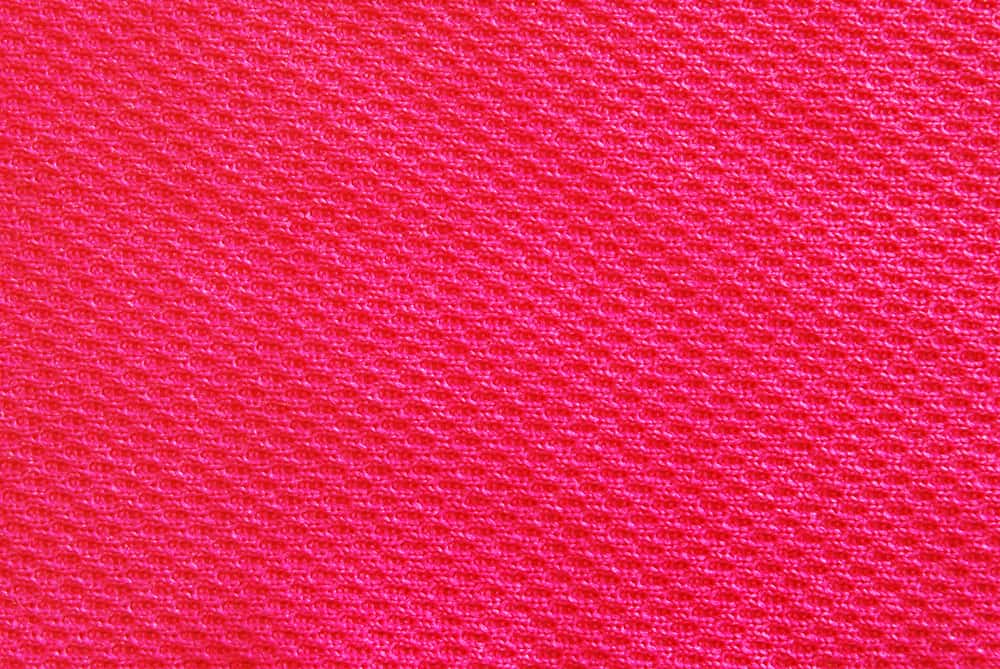 This is a close look at a bright red Interlock Knit fabric.