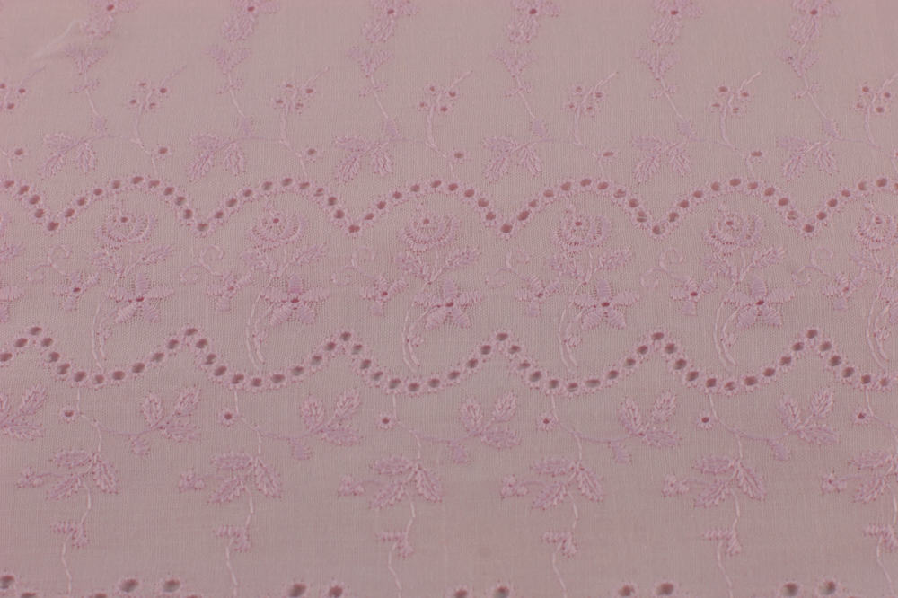 This is a close look at a textured Eyelet fabric.