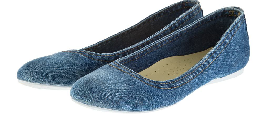 This is a close look at a pair of shoes made of Denim.