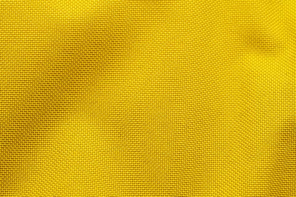 This is a close look at a yellow Nylon fabric.