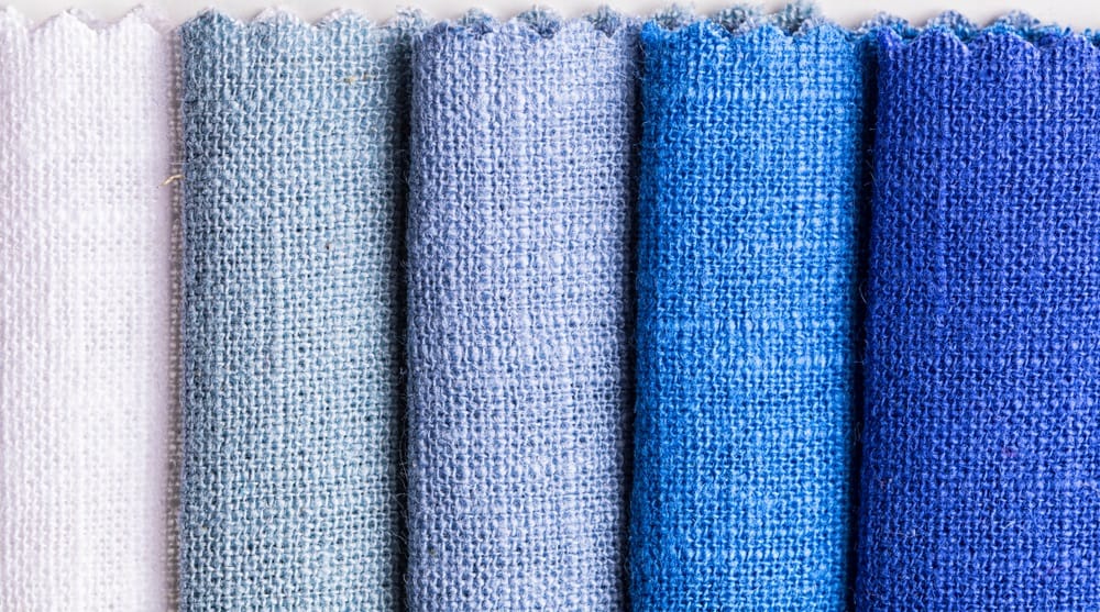 These are various linen fabrics in varying shades of blue.