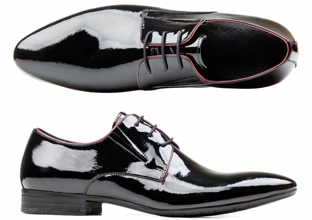 This is a pair of shiny black leather Patent Leather shoes.