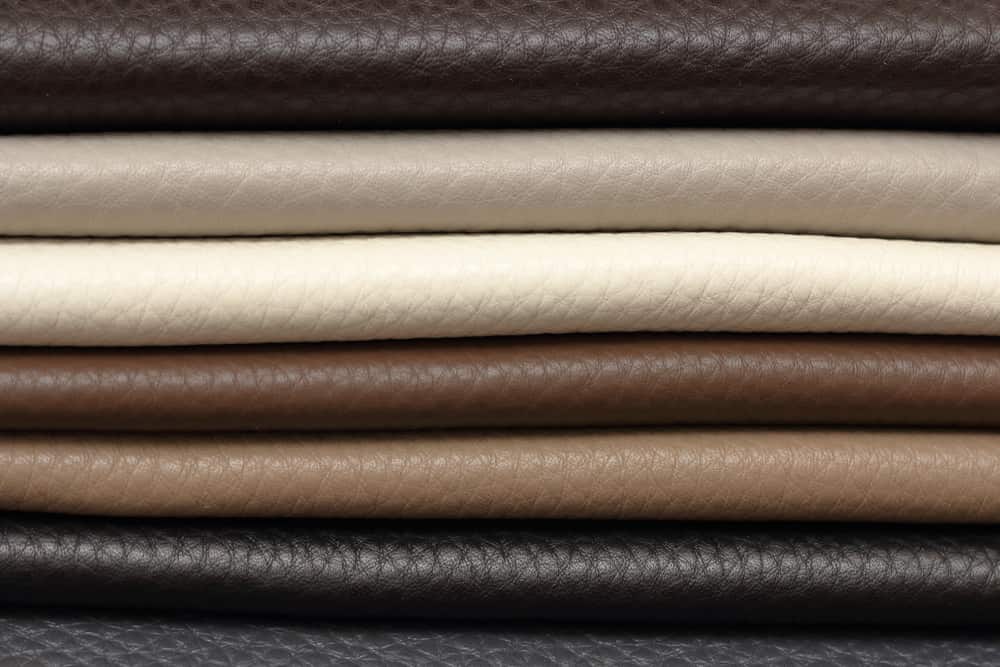 This is a close look at a stack of various Calfskin leather fabrics.