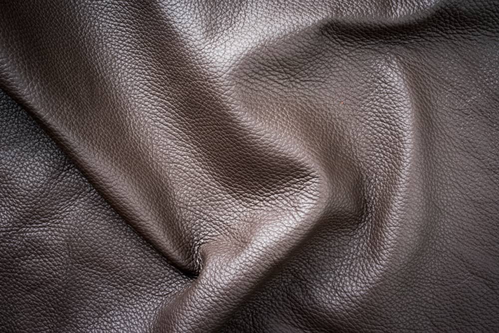 This is a close look at a piece of dark brown Boxcalf leather fabric.