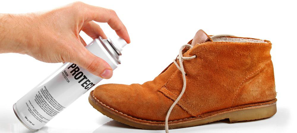 This is a close look at a man maintaining his Suede shoe.