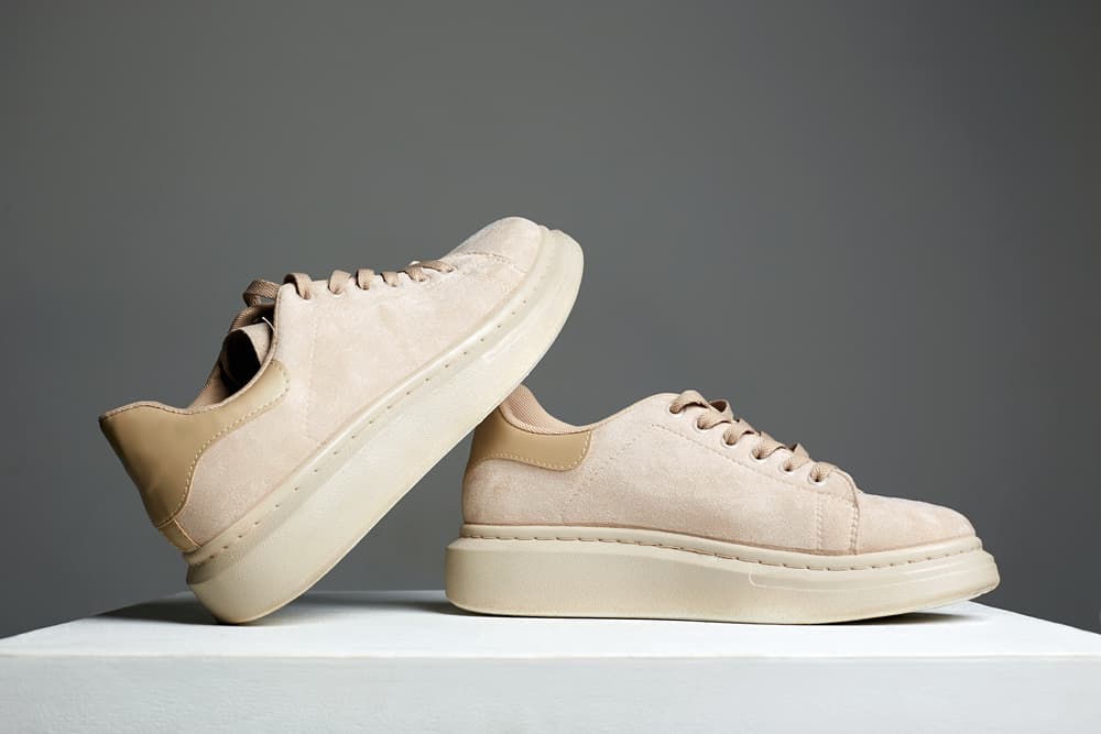 This is a close look at a pair of Cowhide Suede leather sneakers.