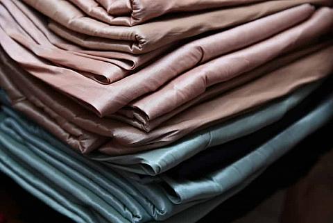 This is a close look at a stack of various special rayon fabrics.