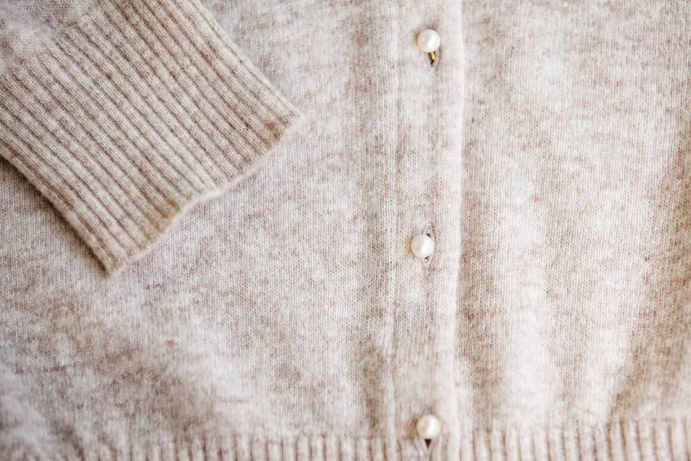 This is a close look at a beige Angora Wool cardigan.