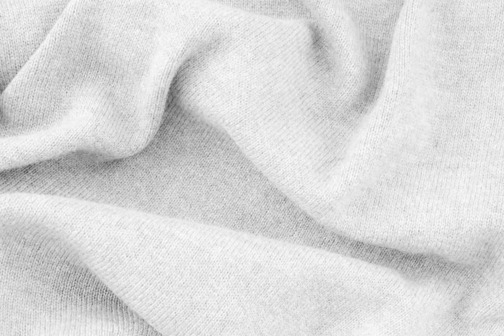 This is a close look at a fine white Cashmere Wool fabric.