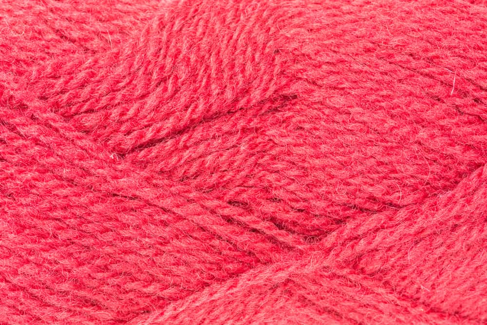 This is a close look at a bright red ball of Shetland Wool.